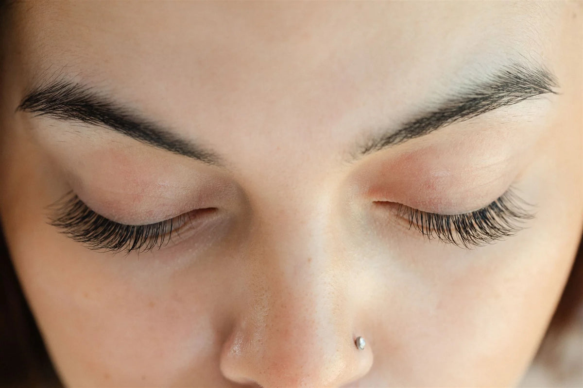 Close-up of Edy London pre-glued lash clusters worn at home
